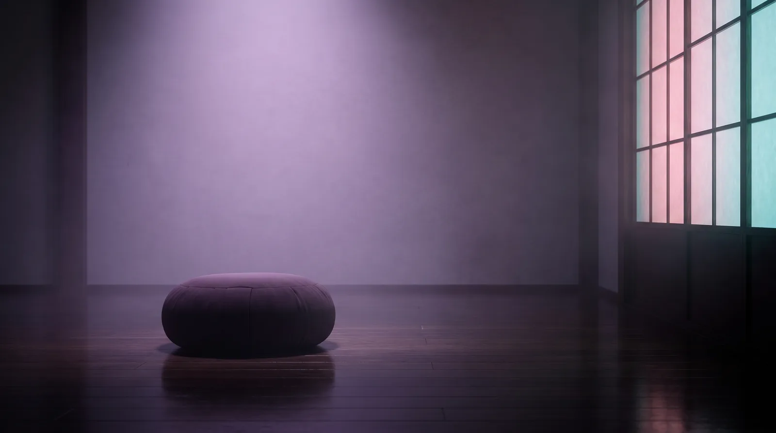 A single meditation cushion on a dark wooden floor, lit by soft lavender light from a paper screen.
